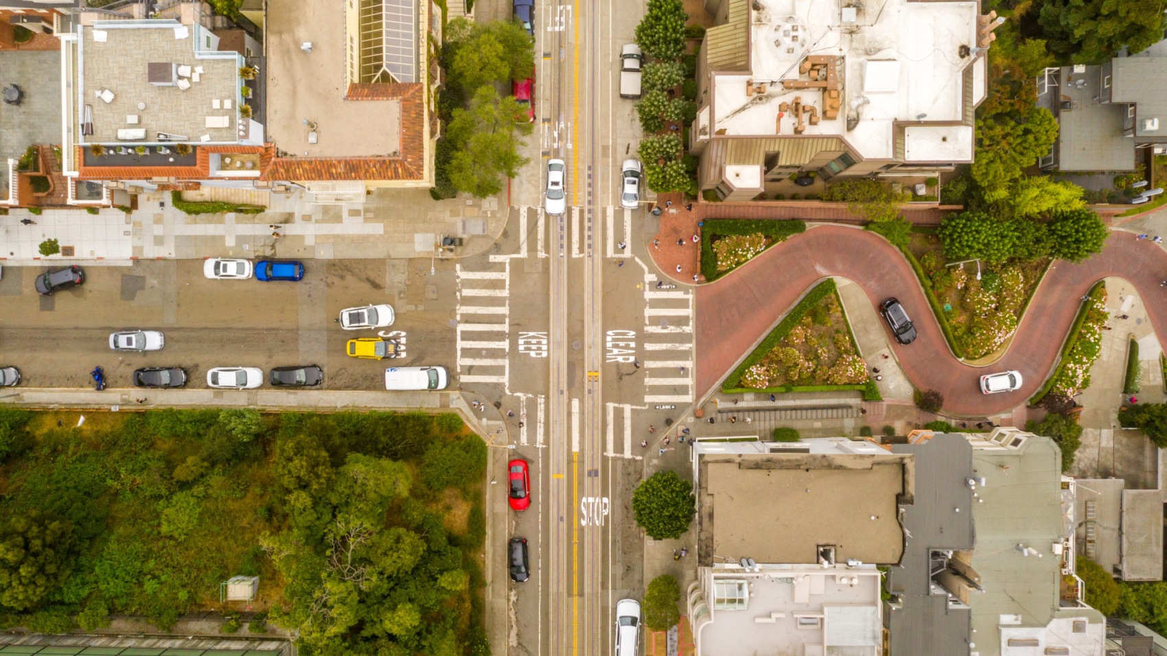 An overhead shot of the buildings and streets of a neighborhood