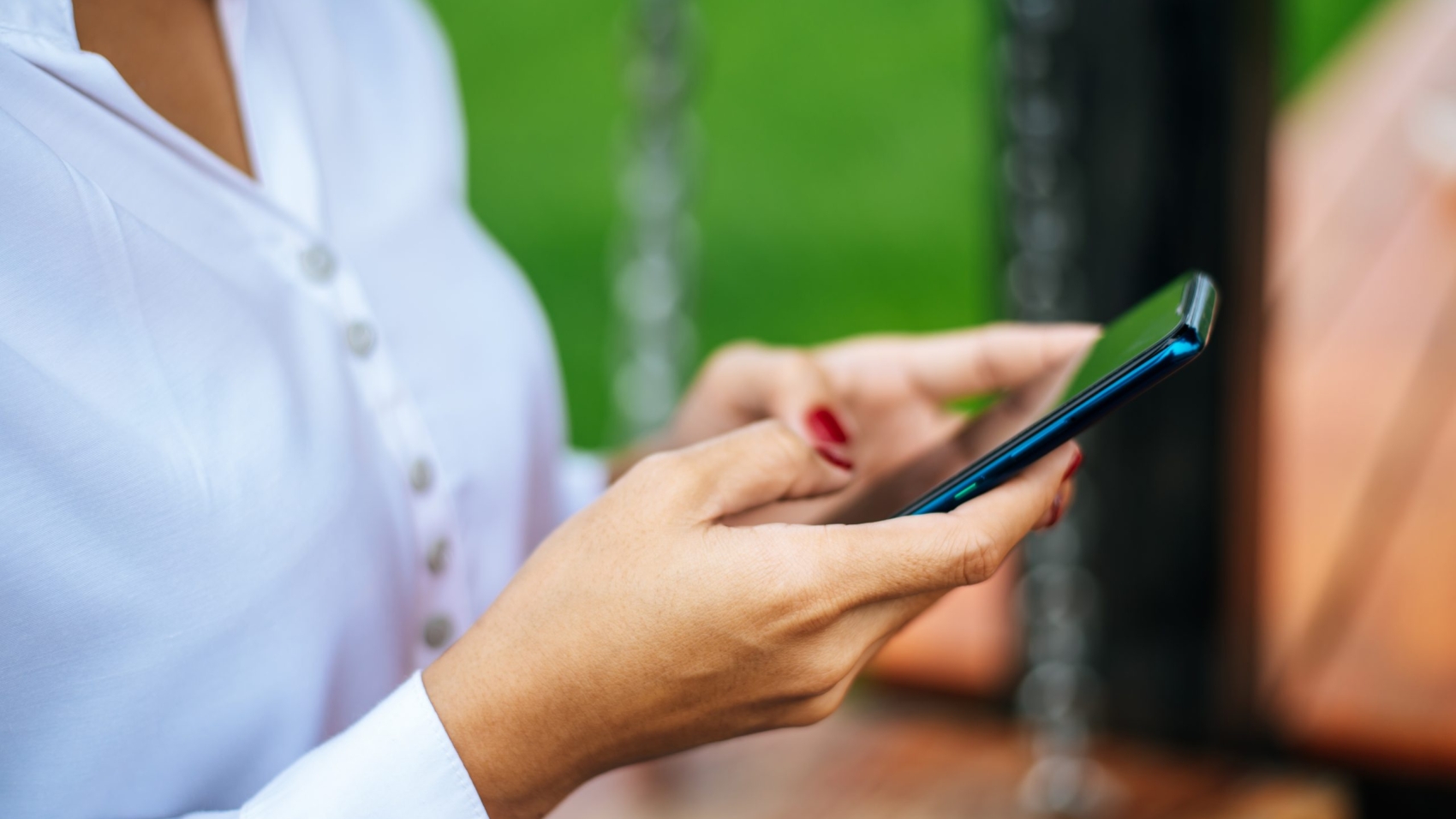 woman standing on a smartphone